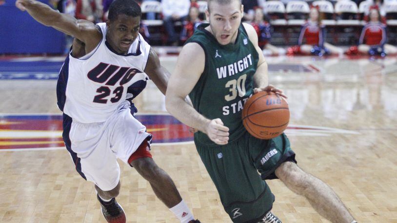 Joe Bramanti, of Wright State, is guarded by Illinois-Chicago’s Jay Parker on Tuesday, Feb. 26, 2013, at the UIC Pavilion in Chicago. David Jablonski/Staff Wright State’s Joe Bramanti is guarded by UIC’s Jay Parker. Wright State lost 60-55 to Illinois-Chicago at UIC Pavilion on Tuesday, Feb. 26, 2013, in Chicago.