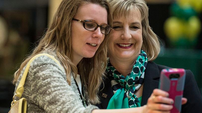 Cheryl Schrader poses for a photo with a student at Wright State University. Schrader took office on Saturday.