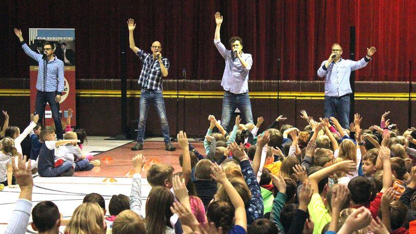 Members of Cadence perform for students at South Vienna School. JEFF GUERINI/STAFF