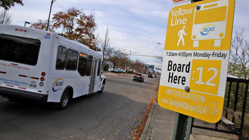 A SCAT bus drives past a bus stop along West Main Street in Springfield Monday, Nov. 6, 2023. BILL LACKEY/STAFF