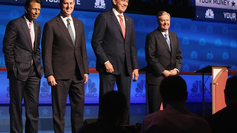 BOULDER, CO - OCTOBER 28: Presidential candidates Louisiana Governor Bobby Jindal (L-R), Rick Santorum, George Pataki, and Sen. Lindsey Graham (R-SC) take the stage for the CNBC Republican Presidential Debate at University of Colorado's Coors Events Center October 28, 2015 in Boulder, Colorado. Fourteen Republican presidential candidates are participating in the third set of Republican presidential debates. (Photo by Justin Sullivan/Getty Images)