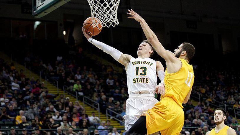Wright State’s Grant Benzinger soars in for a layup in Saturday’s loss to Valparaiso. TIM ZECHAR / CONTRIBUTED