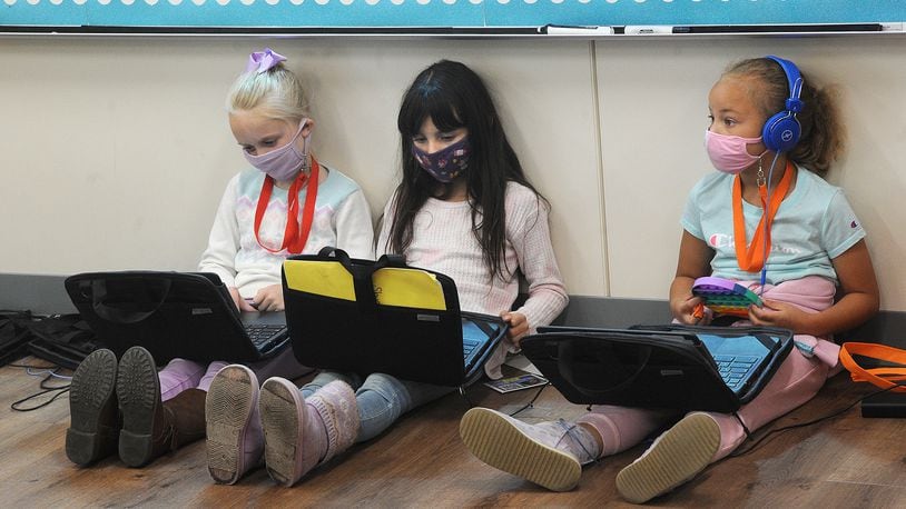 Fairborn Primary students work on computers in the classroom in April 2021. Schools' educational efforts were disrupted repeatedly in 2020-21 due to COVID-related closures, quarantines and staffing shortages. MARSHALL GORBY\STAFF