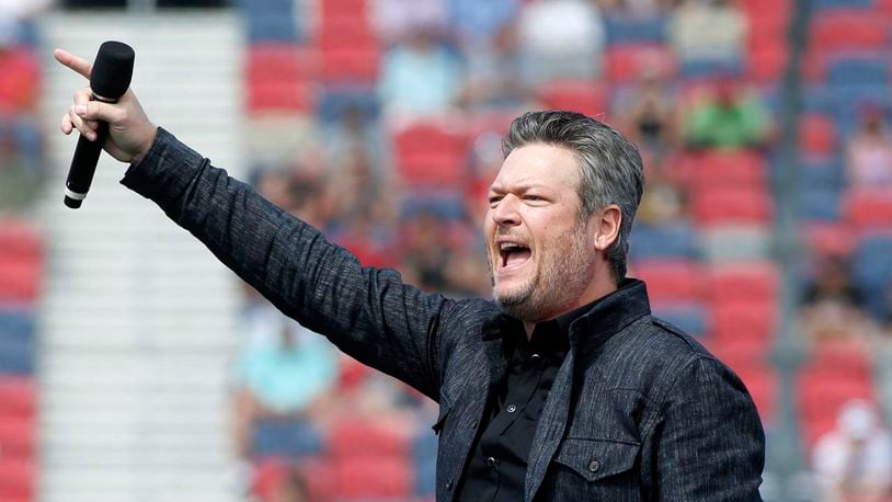 Country music singer and television personality Blake Shelton performs prior to a NASCAR Cup Series auto race at Phoenix Raceway, Sunday, March 8, 2020, in Avondale, Ariz. He will headline a virtual drive-in concert on July 25. (AP Photo)
