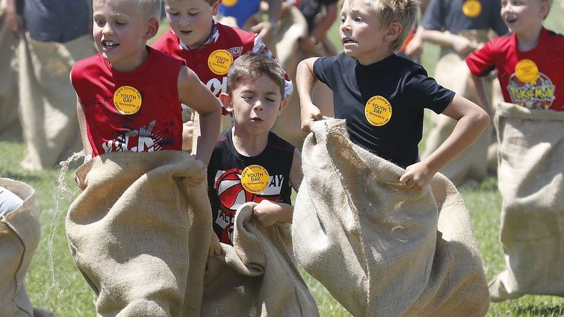 Young boys participate in the Exchange Club’s sack races Wednesday during Kid’s Day at the Clark County Fair. Bill Lackey/Staff