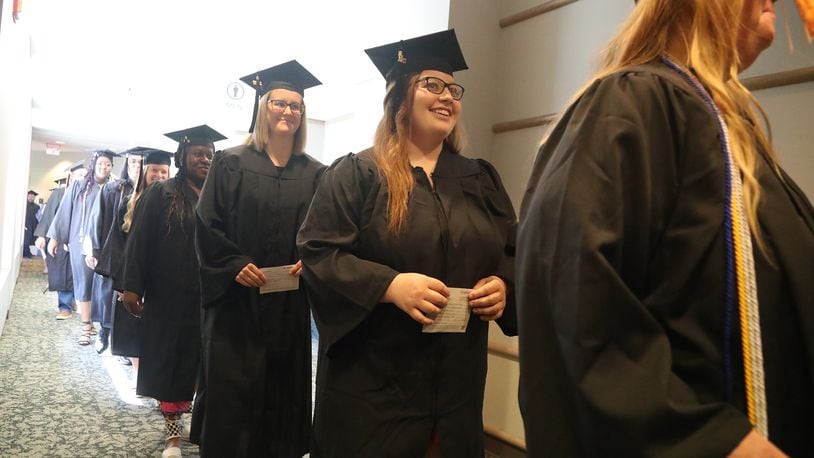 Clark State College and Wittenberg University will celebrate graduation on Saturday, May 13. Here, graduates marched into Kuss Auditorium last year for Clark State's Commencement Ceremony. FILE/BILL LACKEY/STAFF