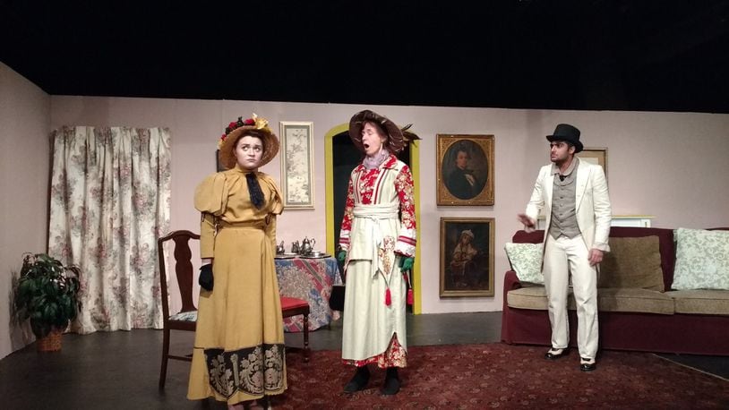 Kylee Pauley, Kathleen Day and Anand Sharma rehearse a scene from the Xenia Area Community Theater’s production of Oscar Wilde’s classic satire, “The Importance of Being Earnest,” directed by Springfield resident Connie Strait. CONNIE STRAIT/CONTRIBUTED