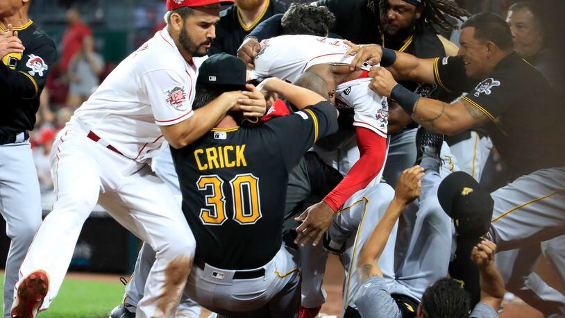 Amir Garrett (middle white shirt with out hat) of the Cincinnati Reds engages members of the Pittsburgh Pirates during a bench clearing altercation in the 9th inning of the game at Great American Ball Park on July 30, 2019 in Cincinnati, Ohio. (Photo by Andy Lyons/Getty Images)