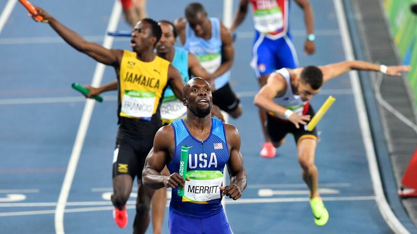 United States' Lashawn Merritt crosses the line to win the men's 4x400-meter relay final during the athletics competitions of the 2016 Summer Olympics at the Olympic stadium in Rio de Janeiro, Brazil, Saturday, Aug. 20, 2016. (AP Photo/Martin Meissner)