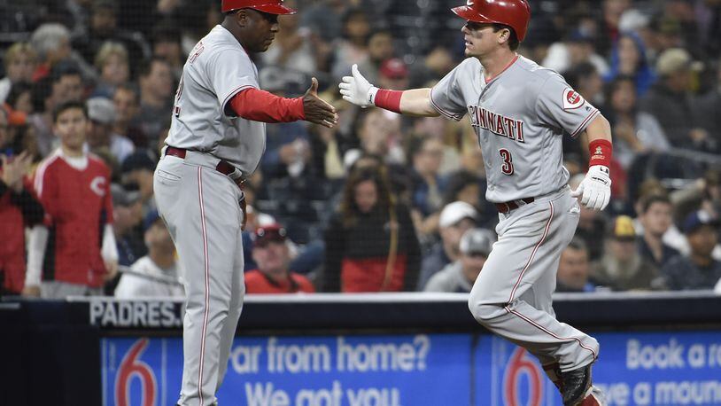 SAN DIEGO, CA - JUNE 1: Scooter Gennett #3 of the Cincinnati Reds is congratulated by Billy Hatcher #22 after hitting a solo home run during the fifth inning of a baseball game against the San Diego Padres at PETCO Park on June 1, 2018 in San Diego, California. (Photo by Denis Poroy/Getty Images)