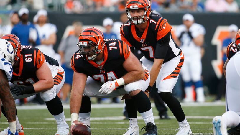 Cincinnati Bengals quarterback Jake Dolegala (7) waits for the snap by offensive tackle Keaton Sutherland (74) during the first half of an NFL preseason football game against the Indianapolis Colts, Thursday, Aug. 29, 2019, in Cincinnati. (AP Photo/Frank Victores)