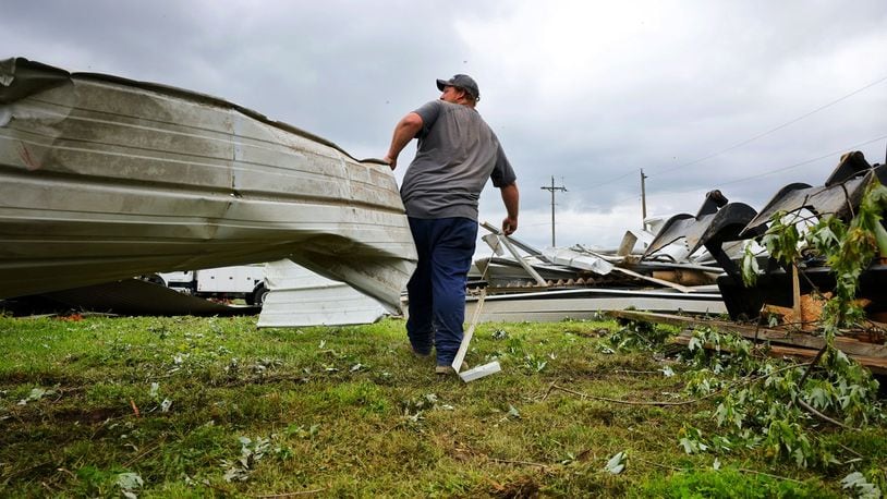 Andy Stang cleans up around a farm on Stillwell Beckett Road in Reily Twp. two days after a tornado Thursday, May 9, 2024. NICK GRAHAM/STAFF