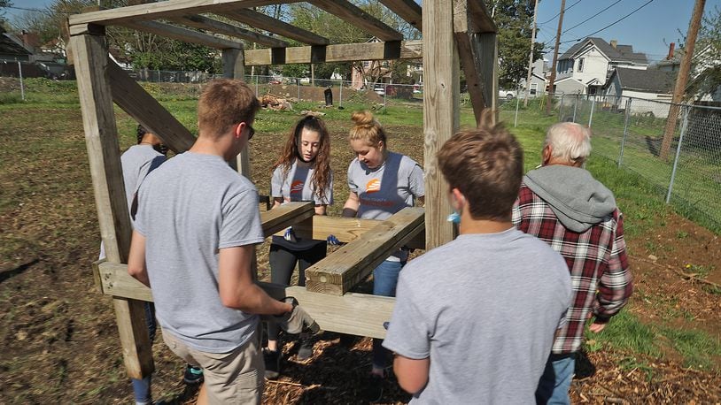 Several events will be held in Clark and Champaign counties this weekend, including Clark County Service Day. Here, volunteers from Catholic Central helped get the Promise Neighborhood's Community Garden ready during last year's Clark County Service Day. BILL LACKEY/STAFF