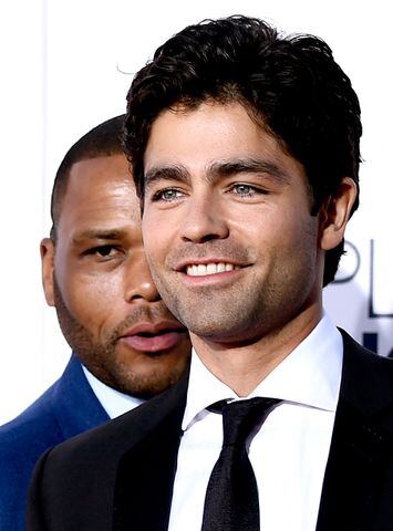 Actor Anthony Anderson (L) photobombs actor Adrien Grenier