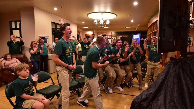 Members of the Wright State golf team react after hearing their name called on the NCAA Tournament selection show Wednesday night. Joseph Craven/CONTRIBUTED