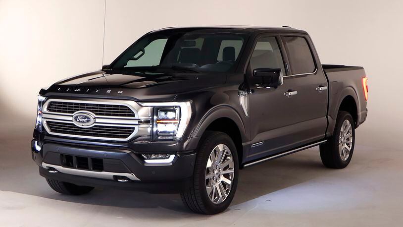 In a photo from, Wednesday, June 24, 2020, the new 2021 Ford F-150 truck is photographed in Ferndale, Mich. Six years ago, Ford bet big on the top-selling vehicle in America, rolling out a radical new version of the F-Series pickup with a lighter aluminum body instead of steel. Now it's time for another revamp, and Ford is playing it safe. On the outside, the truck changes little. The biggest differences are a gas-electric hybrid version, internet connectivity, and a revamped interior that turns the truck into more of a rolling office or even a place to nap. (AP Photo/Carlos Osorio)