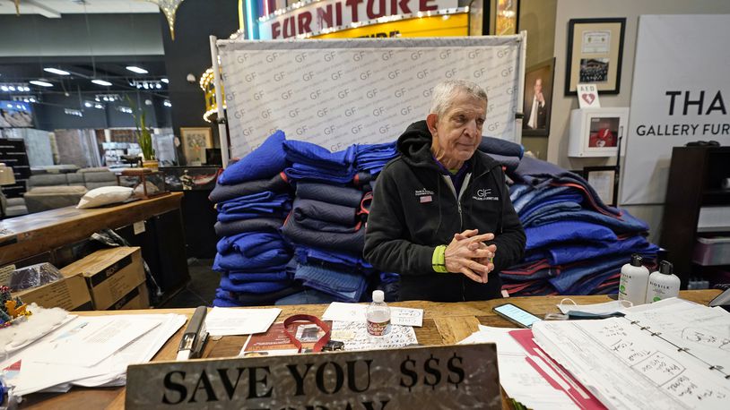 FILE - In this Feb. 17, 2021, file photo, owner Jim McIngvale talks about opening his Gallery Furniture store as a shelter in Houston. (AP Photo/David J. Phillip, File)