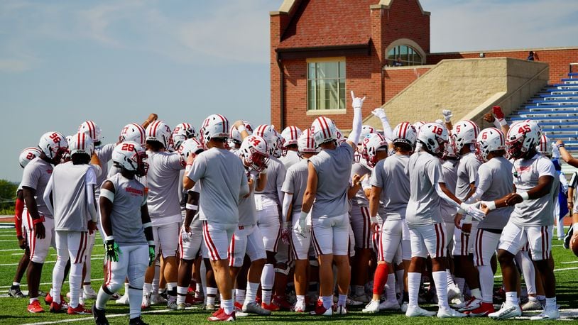 Wittenberg huddles before a game against Dubuque on Saturday, Sept. 2, 2023, in Iowa. Photo courtesy of Wittenberg University