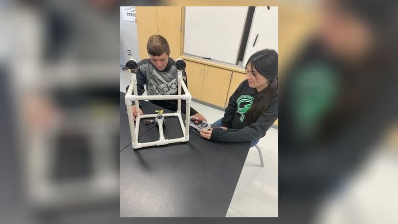 Greenon Junior High School will receive $5,000 to expand STEM learning projects through the Ohio STEM Learning Network Classroom Grant Program, through Battelle. The grant will be used to design a remotely operated vehicle. In this photo is Eli Paulus and Ana Cervantes checking out the prototype and remote of a sample of the project. Contributed