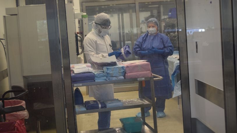 Employees in the clean room at Community Tissue Services in Kettering processing skin tissue grafts on Wednesday, Aug. 16. CONTRIBUTED