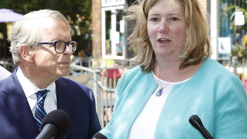 Ohio Governor Mike DeWine is shown in a joint press conference with Dayton Mayor Nan Whaley on Aug. 8 in the Oregon District to talk about mental health initiatives in the wake of the mass shooting that took place on Aug. 4, 2019. DeWine signed a bill that no longer requires Ohioans to first consider retreating in public spaces before using deadly force in self defense. Whaley has criticized the bill and said DeWine has failed to advance reforms he proposed after Dayton's mass shooting.  TY GREENLEES / STAFF