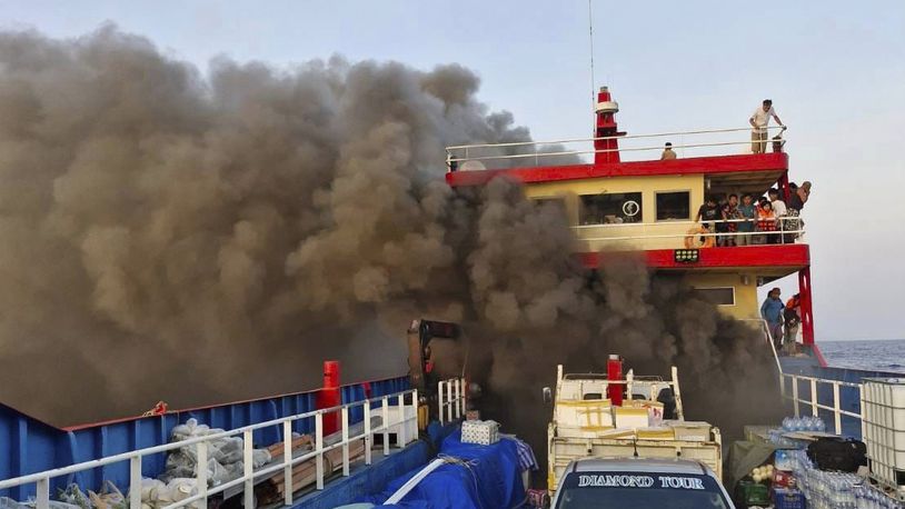 Smoke rises from a ferry in Surat Thani province, Thailand, Thursday, April 4, 2024. The ferry caught fire off the southern Thailand coast on Thursday morning while carrying more than a hundred people, sending panicking passengers to jump into the sea to escape the raging blaze. (Maitree Promjampa via AP)