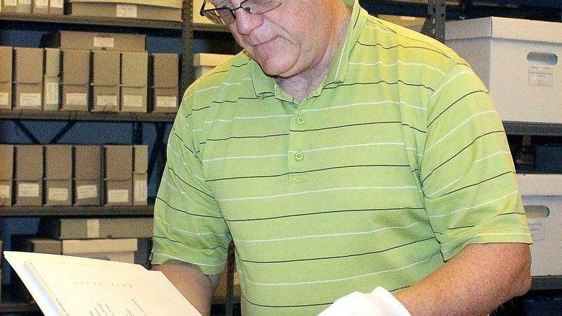 Roger Sherrock, CEO of the Clark County Historical Society looks thru some of the archives that the society houses. JEFF GUERINI/STAFF