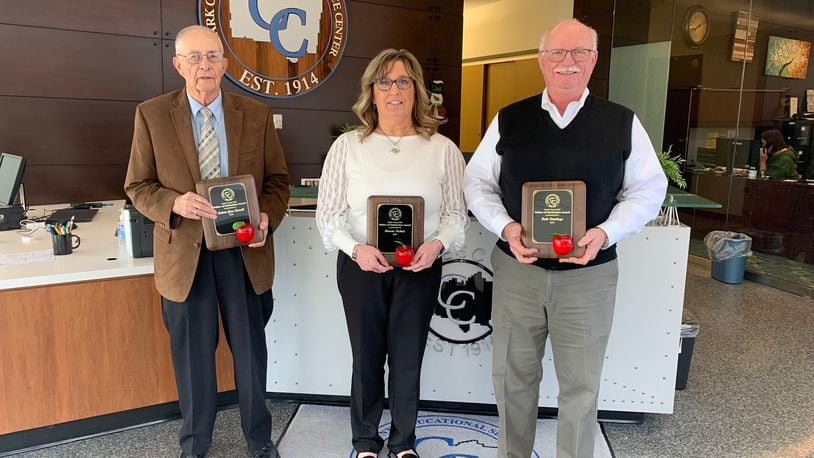 The Clark County Educational Service Center (ESC) honored Melvin Gene Farrell (left), Marcia Nichols and Dale Steinlage (right) with its Fellow of Distinction awards.