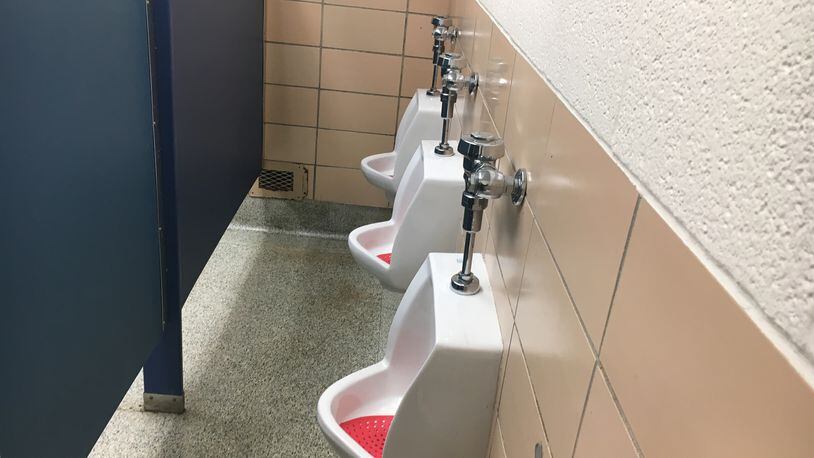 Kettering schools are adding partitions within boys bathrooms that separate the sinks and stalls area from the area with a row of urinals. District officials say the move is to increase student privacy, and it comes on the heels of 2016's national debate over transgender bathroom usage. JEREMY P. KELLEY / STAFF