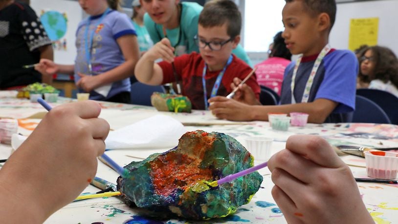 Campers work together to paint “Kindness Rocks” during the 32nd Annual Peace Camp at Roosevelt Middle School. Bill Lackey/Staff