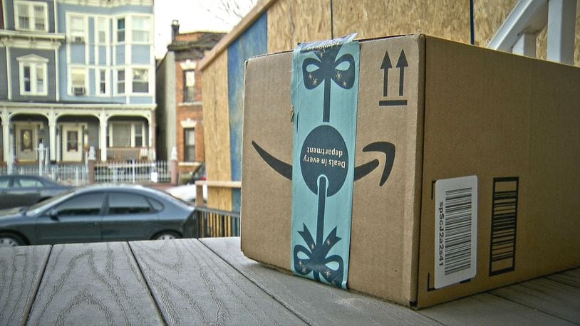 An Amazon package is seen on the porch of a Jersey City, N.J. residence after its delivery Tuesday, Dec. 11, 2018. An Indianapolis man has been charged with felony criminal confinement after he confronted an undercover police officer he thought was a potential package thief.