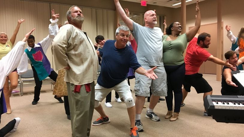 The leads of “Monty Python’s Spamalot” put the big finish on a dance number during rehearsals for the production. Cast members include (from left) Dan Carey, Dan Hunt, Troy Berry, Tia Seay, Ryan McCarty and Brice Thomas. CONTRIBUTED