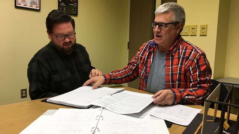 Director James Straley, left, and writer Dan Hunt go over the music written by Hunt for the original musical comedy “The Last Pirates of the Vast Golden Treasure,” which will be performed by the Clark State Theatre Arts Program in April. CONTRIBUTED PHOTO BY BRETT TURNER
