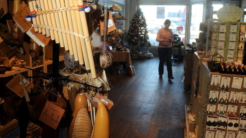 Melissa Townsend walks through the newly opened Fair Trade Winds store on North Fountain Ave. Staff file photo