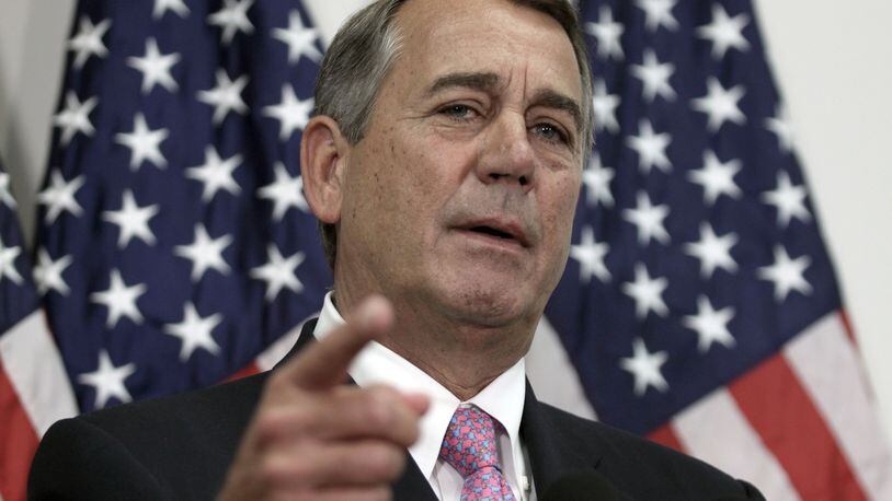 Outgoing House Speaker John Boehner of Ohio talks with reporters on Capitol Hill in Washington, Tuesday, Oct. 27, 2015. House Republican leaders on Tuesday pushed toward a vote on a two-year budget deal despite conservative opposition, relying on the backing of Democrats for the far-reaching pact struck with President Barack Obama. In his last days as speaker, John Boehner was intent on getting the measure through Congress and head off a market-rattling debt crisis next week and a debilitating government shutdown in December. The deal also would take budget showdowns off the table until after the 2016 presidential and congressional elections, a potential boon to the eventual GOP nominee and incumbents facing tough re-election fights. (AP Photo/Lauren Victoria Burke)