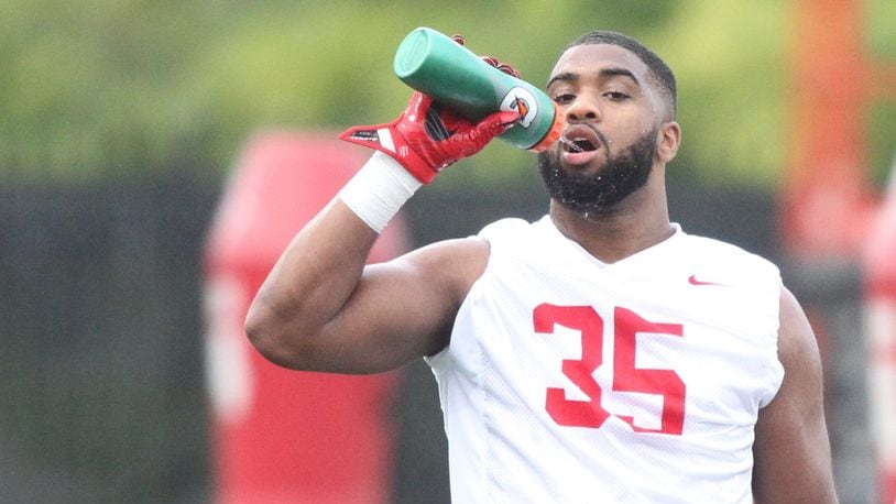 Ohio State’s Chris Worley gets a drink during practice on Thursday, July 27, 2017, at the Woody Hayes Athletic Center in Columbus. David Jablonski/Staff
