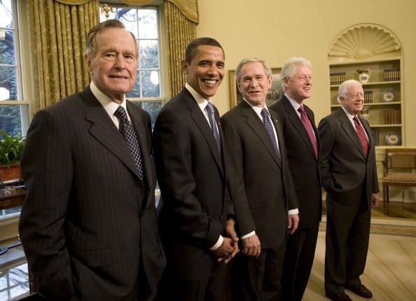 2009: Former President George H.W. Bush, President-elect Barack Obama, President George W. Bush, and former presidents Bill Clinton and Jimmy Carter pose together in the Oval Office