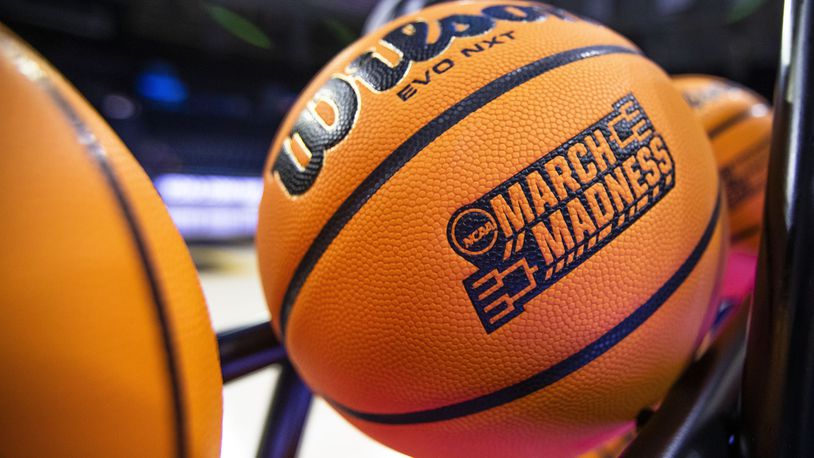 FILE - A basketball with a March Madness logo rests on a rack before a First Four game between Illinois and Mississippi State in the NCAA women's basketball tournament Wednesday, March 15, 2023, in South Bend, Ind.  (AP Photo/Michael Caterina, File)
