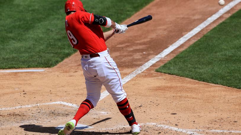 Cincinnati Reds' Joey Votto hits a two-run RBI double during the fifth inning of a baseball game against the Cleveland Indians in Cincinnati, Sunday, April 18, 2021. (AP Photo/Aaron Doster)