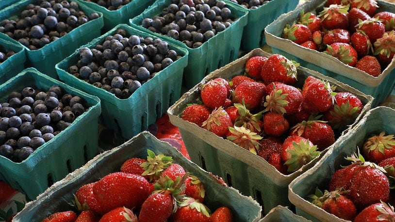 Fresh strawberries and blueberries at the Corn Crib Farm Market. BILL LACKEY/STAFF