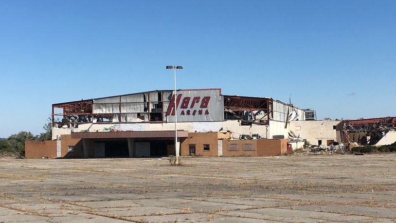 Hara Arena remained in ruins Monday, Oct. 14, more than four months after it was heavily damaged in the Memorial Day tornadoes. Property owners say a rezoning is needed before they can begin cleanup and redevelopment.