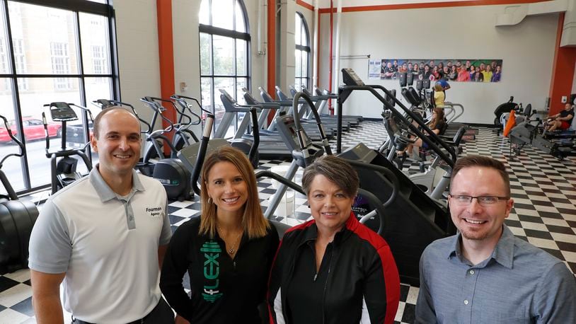 Pat Frock, second from right, is selling Springfield Health and Fitness to, from left, Jeff Fourman, Alexis Fourman and Blake Shaffer after more than 15 years. It started with 250 square feet in the Bushnell Building and grew to 4,300 square feet and more than 40 employees at the former News-Sun building. Bill Lackey/Staff