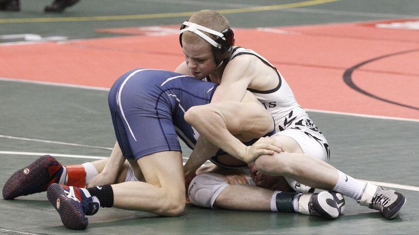 Eli Stickley of St. Paris Graham wrestles Seth Beard of Napoleon at 106 lbs. during the semi-final round of the Ohio high school wrestling championships at the Jerome Schottenstein Center in Columbus on Friday, March 1, 2013. Barbara J. Perenic/Staff