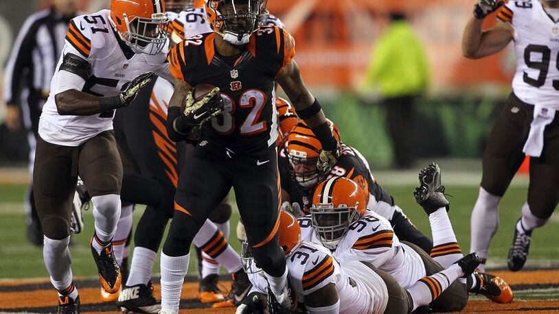 Jeremy Hill #32 of the Cincinnati Bengals breaks the tackle by Donte Whitner #31 of the Cleveland Browns during the first quarter at Paul Brown Stadium on Nov. 6, 2014, in Cincinnati. (Photo by John Grieshop/Getty Images)