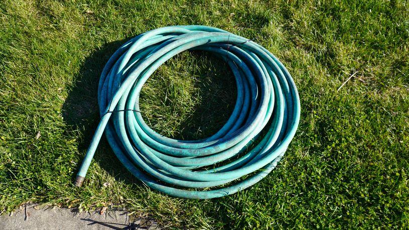 Roll hoses up and store them inside a garage, barn, or away from the winter elements.