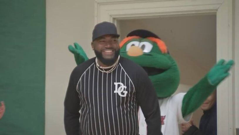 Former Red Sox slugger David Ortiz surprised some students as the team handed out hats.