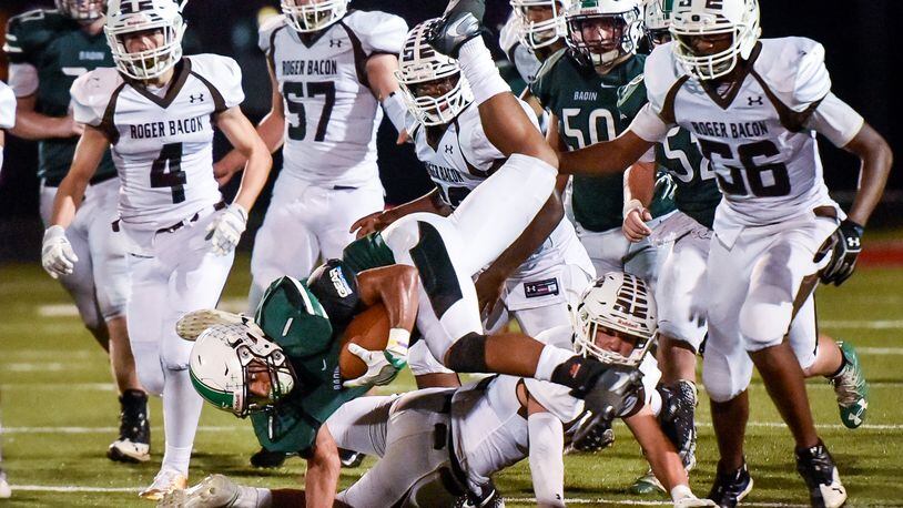 Badin’s Davon Starks gets inverted as he carries the ball during their game against Roger Bacon Friday, Sept. 22 at Fairfield Stadium in Fairfield. The Rams won 41-21. NICK GRAHAM/STAFF