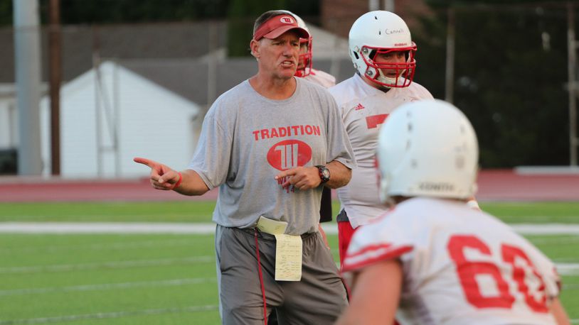 Wittenberg University football coach Joe Fincham runs the Tigers offensive linemen through a drill during the first day of practice on Wednesday at Edwards-Maurer Field in Springfield. The Tigers, ranked 14th in the d3football.com preseason poll, have won seven of the last nine North Coast Athletic Conference titles. Michael Cooper/CONTRIBUTED