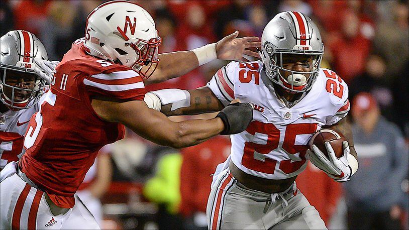 LINCOLN, NE - OCTOBER 14: Running back Mike Weber #25 of the Ohio State Buckeyes runs from linebacker Dedrick Young II #5 of the Nebraska Cornhuskers at Memorial Stadium on October 14, 2017 in Lincoln, Nebraska. (Photo by Steven Branscombe/Getty Images)