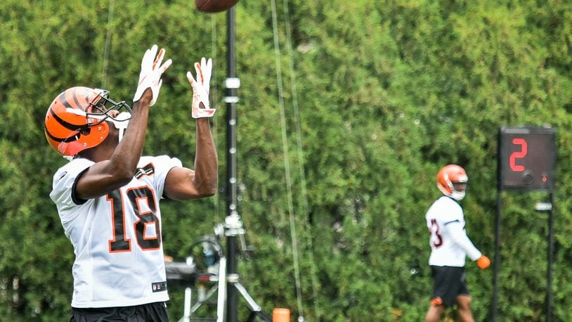 Bengals’ wide receiver A.J. Green catches a pass during organized team activities Tuesday, May 22 at the practice facility near Paul Brown Stadium in Cincinnati. NICK GRAHAM/STAFF